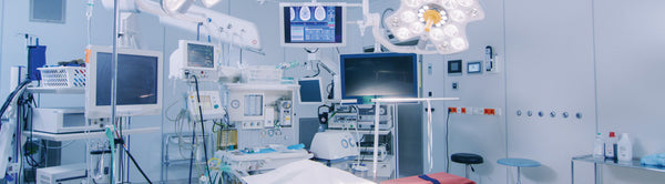 Modern medical equipment setup with monitors, cables, and sterile environment in an operating room.